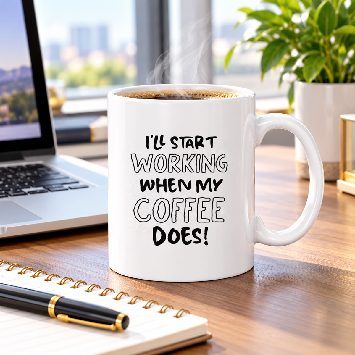 Funny work coffee mug beside a laptop in a bright workspace
