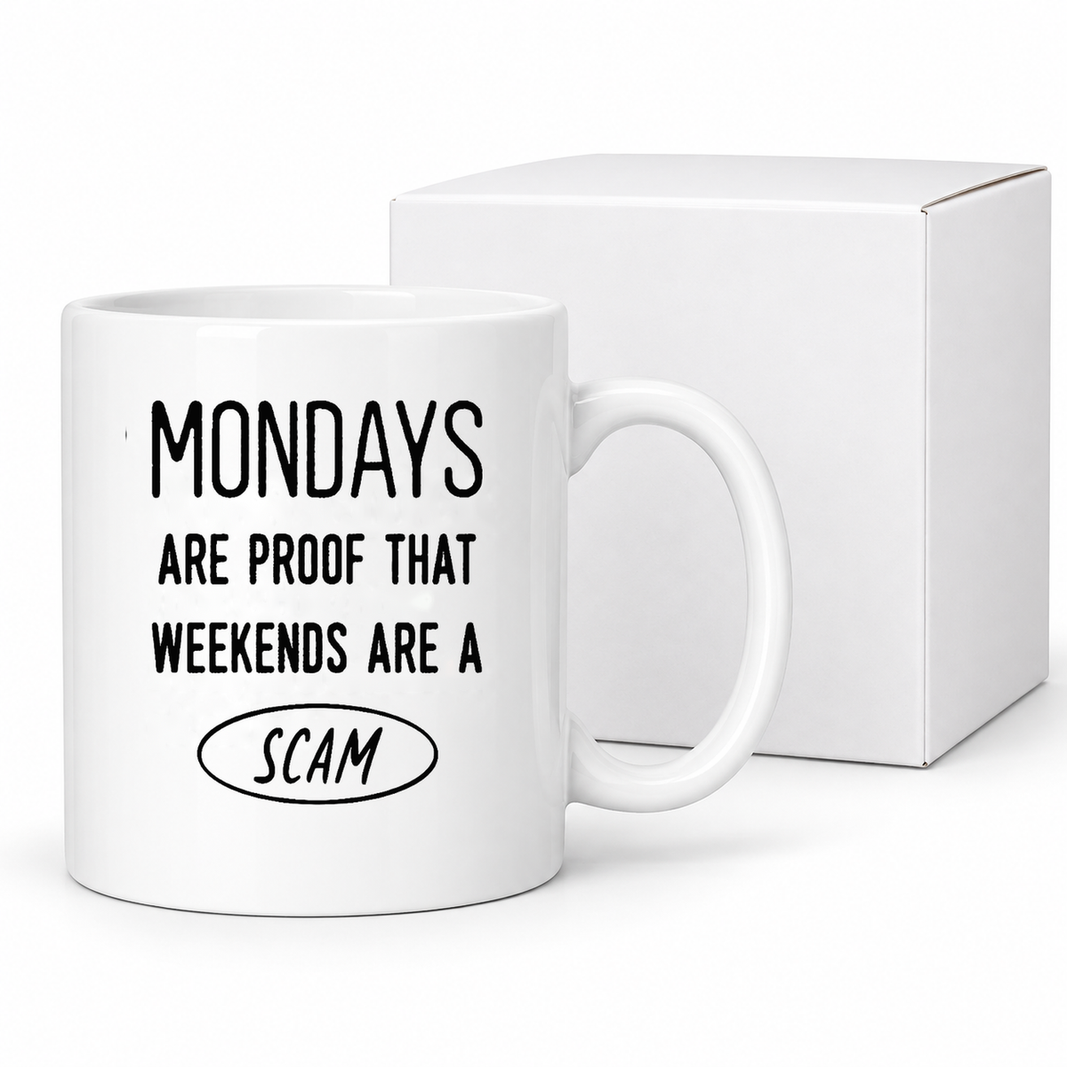 Mondays Are a Scam ceramic mug beside protective white box